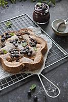 hazelnut giant financier cake with black currants