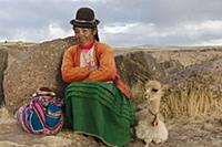 PERU / Puno / Sillustani / Quechua woman with Llam