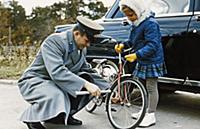 3910118 Cosmonaut Yuri Gagarin Helping his Daughte