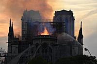 Smoke billows from Notre Dame Cathedral after a fi