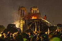 Firefighters douse flames from the burning Notre D