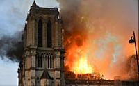 Smoke billows from Notre Dame Cathedral after a fi