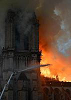 Smoke billows from Notre Dame Cathedral after a fi