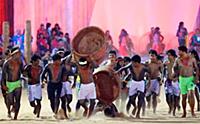 The Gaviao people log bearer falls as they perform