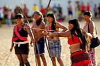 Woman demonstrate bow and arrow at the first World