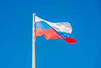 Russian state flag waving in the wind against the 