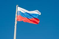 Russian state flag waving in the wind against the 