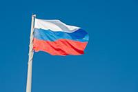 Russian state flag waving in the wind against the 