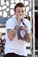 Louis Tomlinson of One Direction performs on Good 