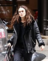 Actress Keira Knightley wears a sheepskin flying j