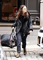 Actress Keira Knightley wears a sheepskin flying j