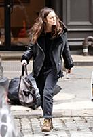 Actress Keira Knightley wears a sheepskin flying j