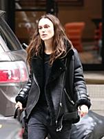 Actress Keira Knightley wears a sheepskin flying j