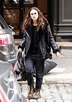 Actress Keira Knightley wears a sheepskin flying j