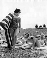 Windmill girls on the beach . Standing  Hala Dunca