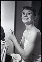 Audrey Hepburn makes up for a performance of Gigi 