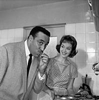 Ray Ellington, 1915-1985, at home in London with w