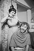 Spike Milligan gets a haircut, at home in north Lo