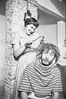 Spike Milligan gets a haircut, at home in north Lo