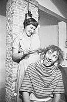 Spike Milligan gets a haircut, at home in north Lo