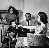 Ray Ellington, 1915-1985, at home in London with w
