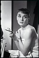 Audrey Hepburn makes up for a performance of Gigi 