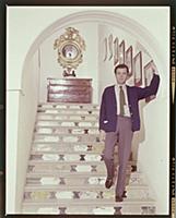 Dirk Bogarde, the film star and writer, at home at