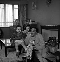 Ray Ellington, 1915-1985, at home in London with w