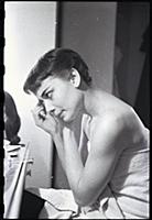 Audrey Hepburn makes up for a performance of Gigi 