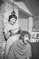 Spike Milligan gets a haircut, at home in north Lo