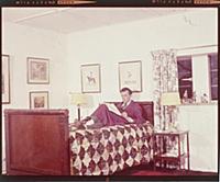 Dirk Bogarde, the film star and writer, at home at