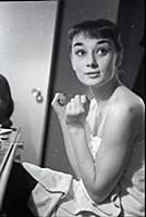 Audrey Hepburn makes up for a performance of Gigi 