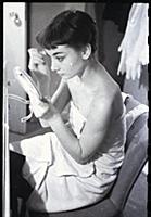 Audrey Hepburn makes up for a performance of Gigi 