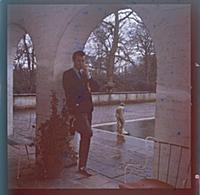 Dirk Bogarde, the film star and writer, at home at