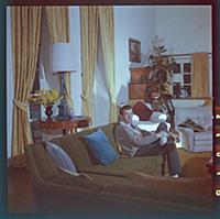Dirk Bogarde, the film star and writer, at home at
