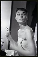 Audrey Hepburn makes up for a performance of Gigi 