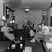 Ray Ellington, 1915-1985, at home in London with w