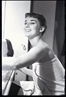 Audrey Hepburn makes up for a performance of Gigi 