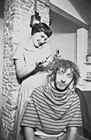 Spike Milligan gets a haircut, at home in north Lo