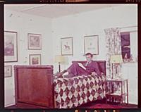 Dirk Bogarde, the film star and writer, at home at