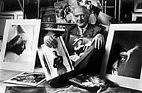 Cecil Beaton in the 1960s with some of his portfol