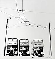 Trollybuses and overhead wires on a snowy winter d