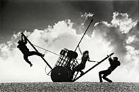 Three dynamic actors on Brighton Beach during a 19