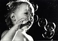 Baby enchanted by bubbles, early 1970s