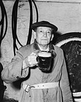 Man with a pint of beer at the Blue Anchor in Hels