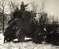 'Red Guard soldiers with a captured armoured car, 