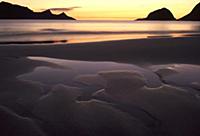 Beach and mountains at sunset, Lofoten, Norway