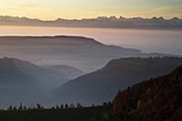 Evening view over misty countryside, towards the a