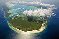 Clouds forming a ring over raised coral atoll, Ald