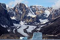 Icebergs along coastal mountains and glacier, Scor